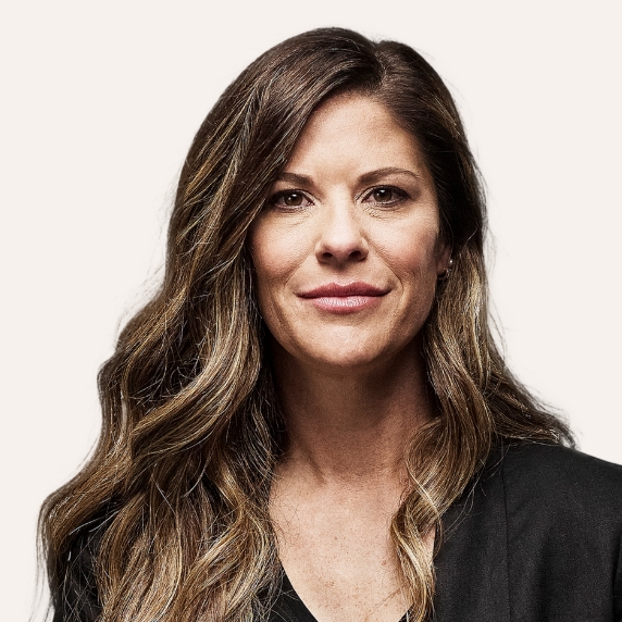 Female Heartland Supported Doctor wearing a dark shirt