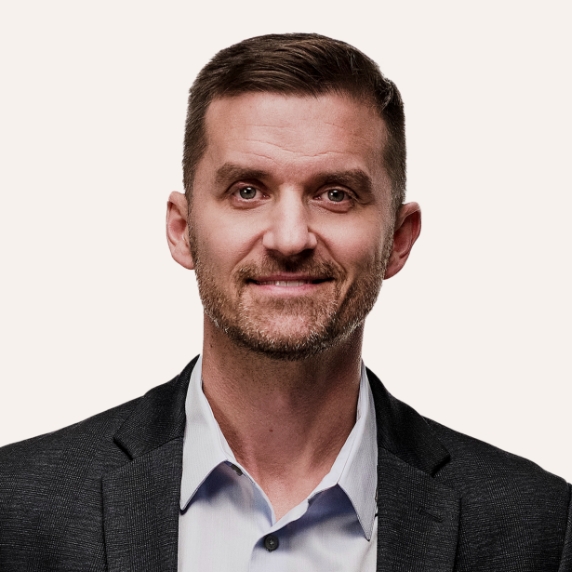 Close up of confident male dentist wearing a dark jacket